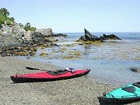 Beached Kayaks by Portland Headlight