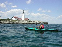 Kayak in front of Portland Headlight - Photoshop water color filter applied.